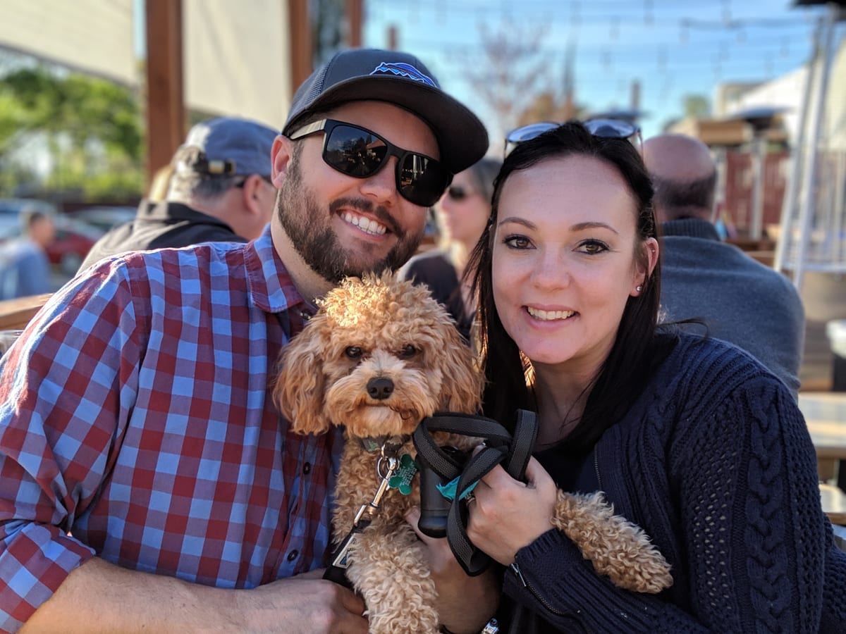 Mike and Natalya, owners of Front Range Stain & Seal, with their dog Cooper