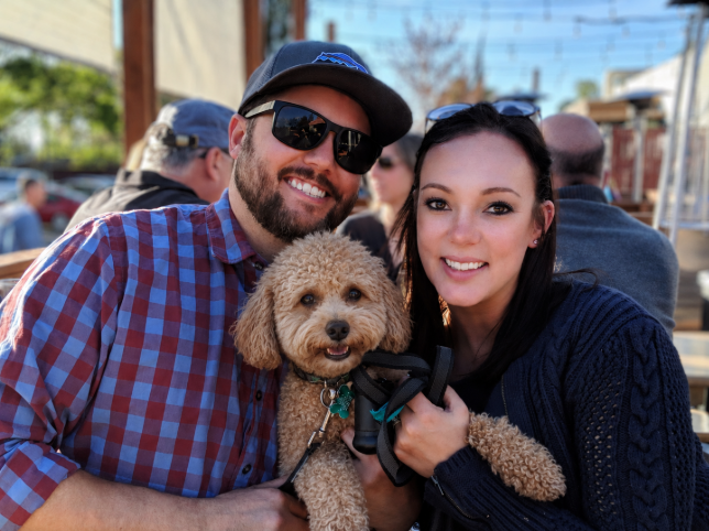Mike and Natalya, owners of Front Range Stain & Seal, with their dog Cooper