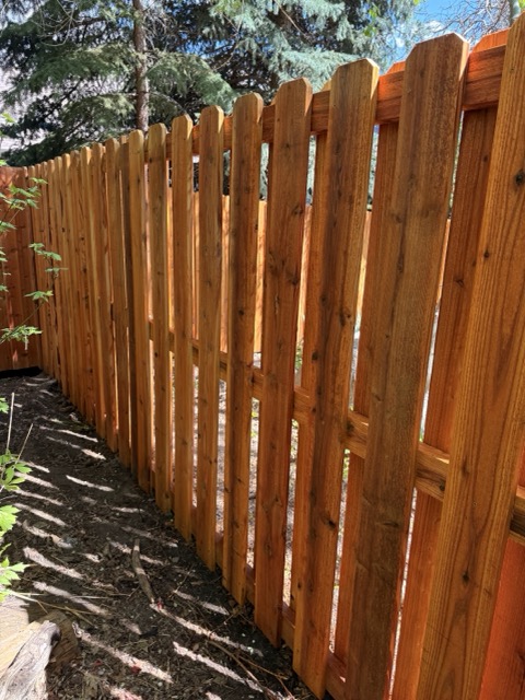 Shadowbox cedar fence with spaced boards for airflow